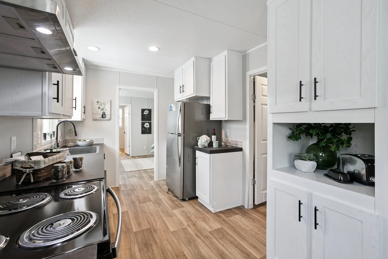 Photo: Kitchen, Bravo 16763N. Cavco's photo of this model; it can show options and other finishes.