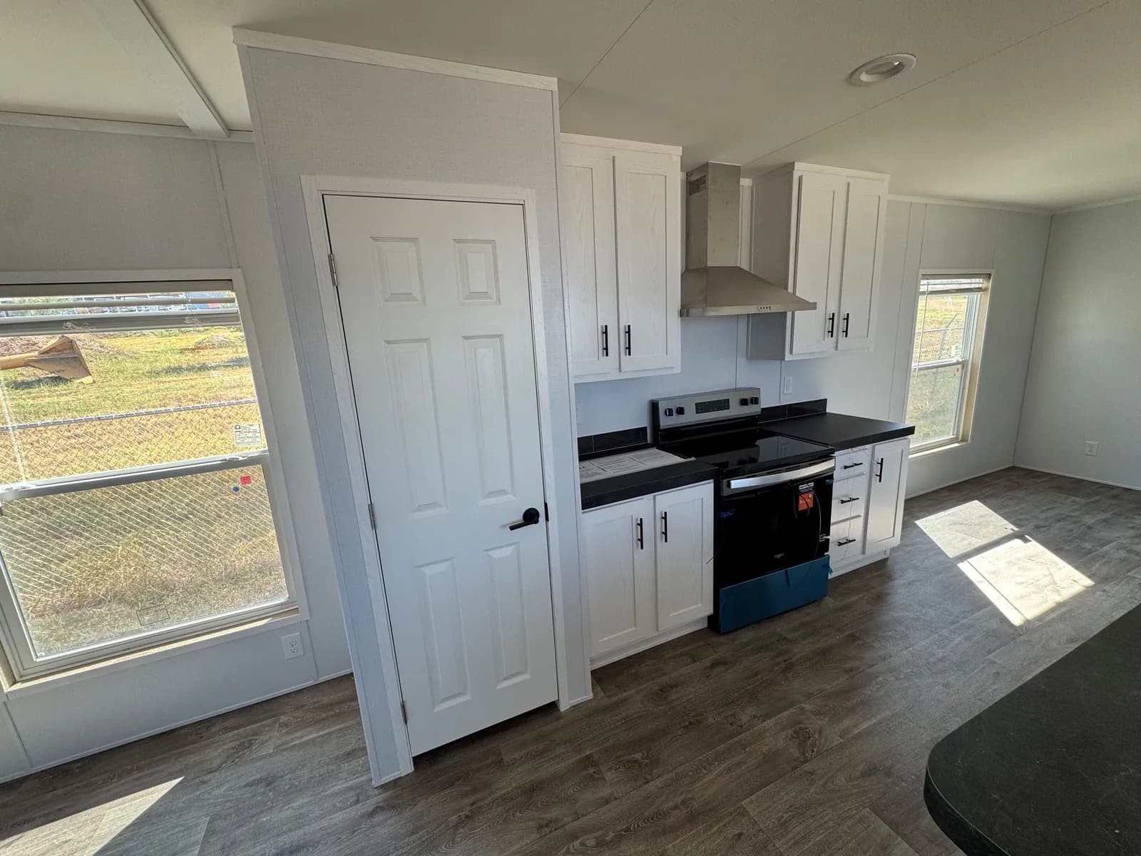 Photo: Kitchen, Landmark 16763A. Cavco's photo of this model; it can show options and other finishes.