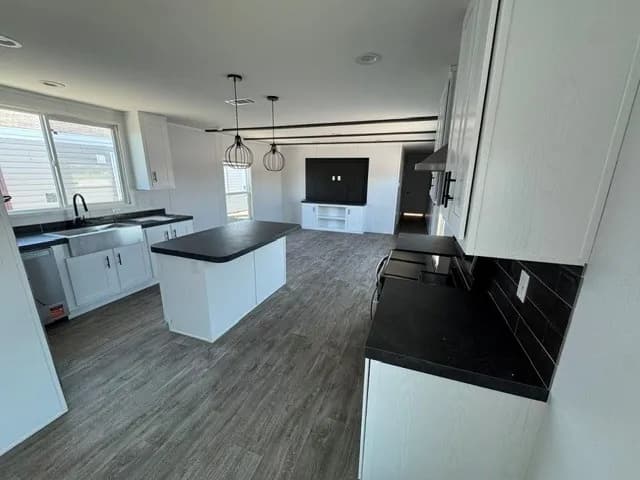 Photo: Kitchen, Landmark 16763A. Cavco's photo of this model; it can show options and other finishes.