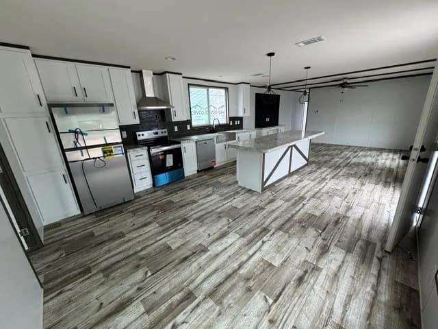 Photo: Kitchen, Landmark 16763E. Cavco's photo of this model; it can show options and other finishes.