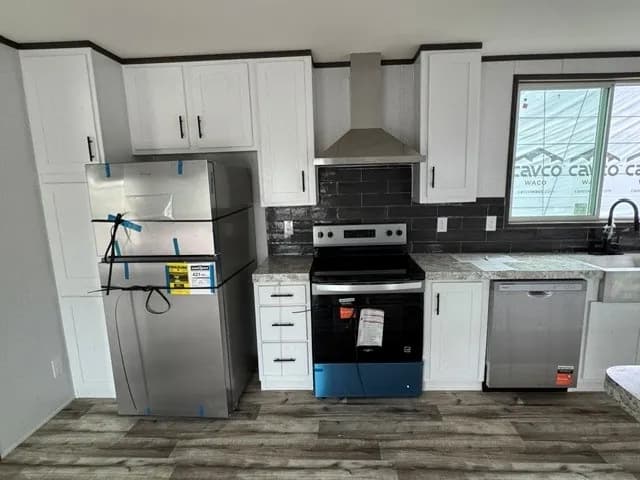 Photo: Kitchen, Landmark 16763E. Cavco's photo of this model; it can show options and other finishes.