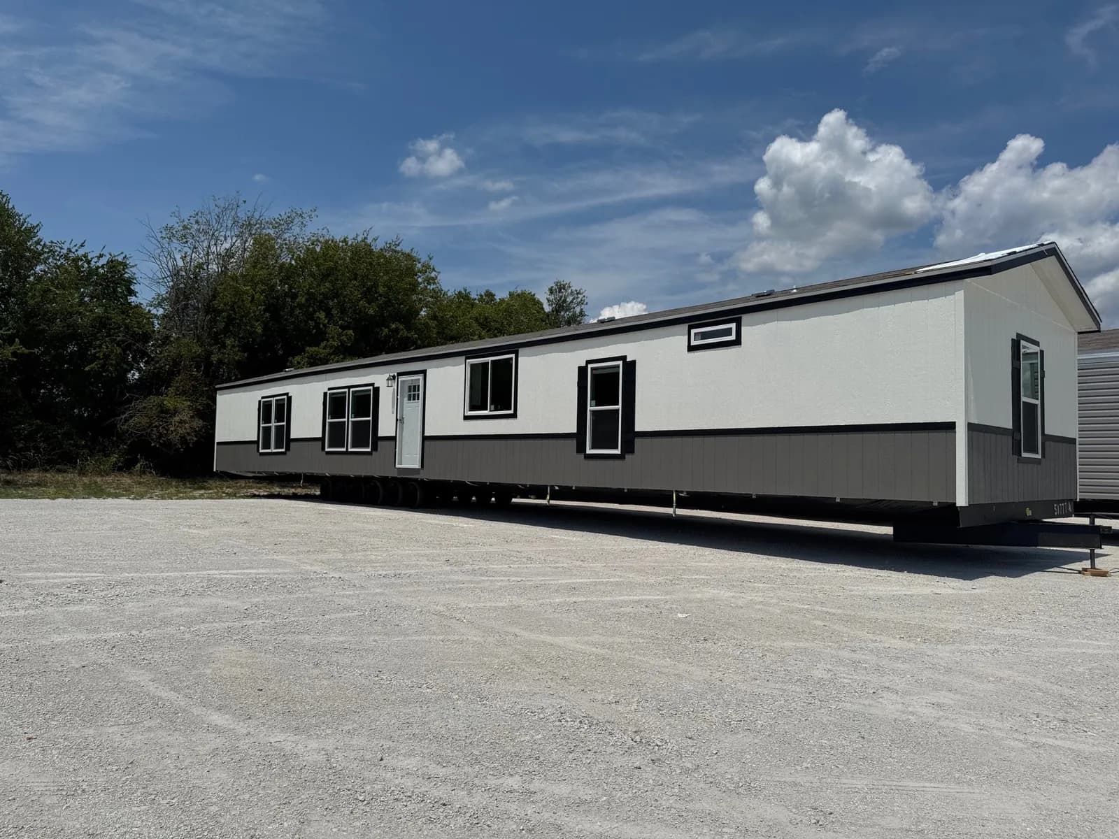 Photo: Exterior, Landmark 16763J. Cavco's photo of this model; it can show options and other finishes.