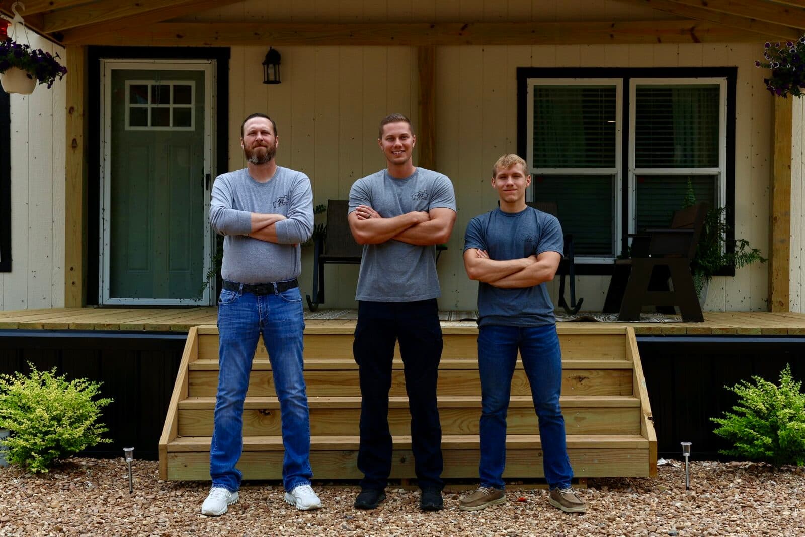 Jared Wiggins, Jacob Belgard, and Hunter McGaha — the JB Mobile Homes team — outside a Cavco home in Deville, Louisiana
